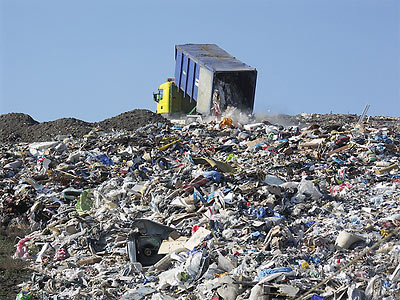 Dumping trash in a landfill Dumping trash in a landfill