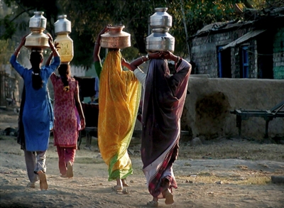 Women fetching water from kilometers away Women fetching water from kilometers away